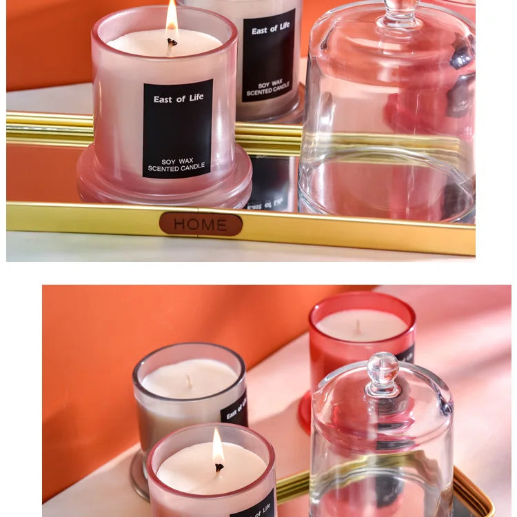 شمعة معطرة في كوب زجاجي.