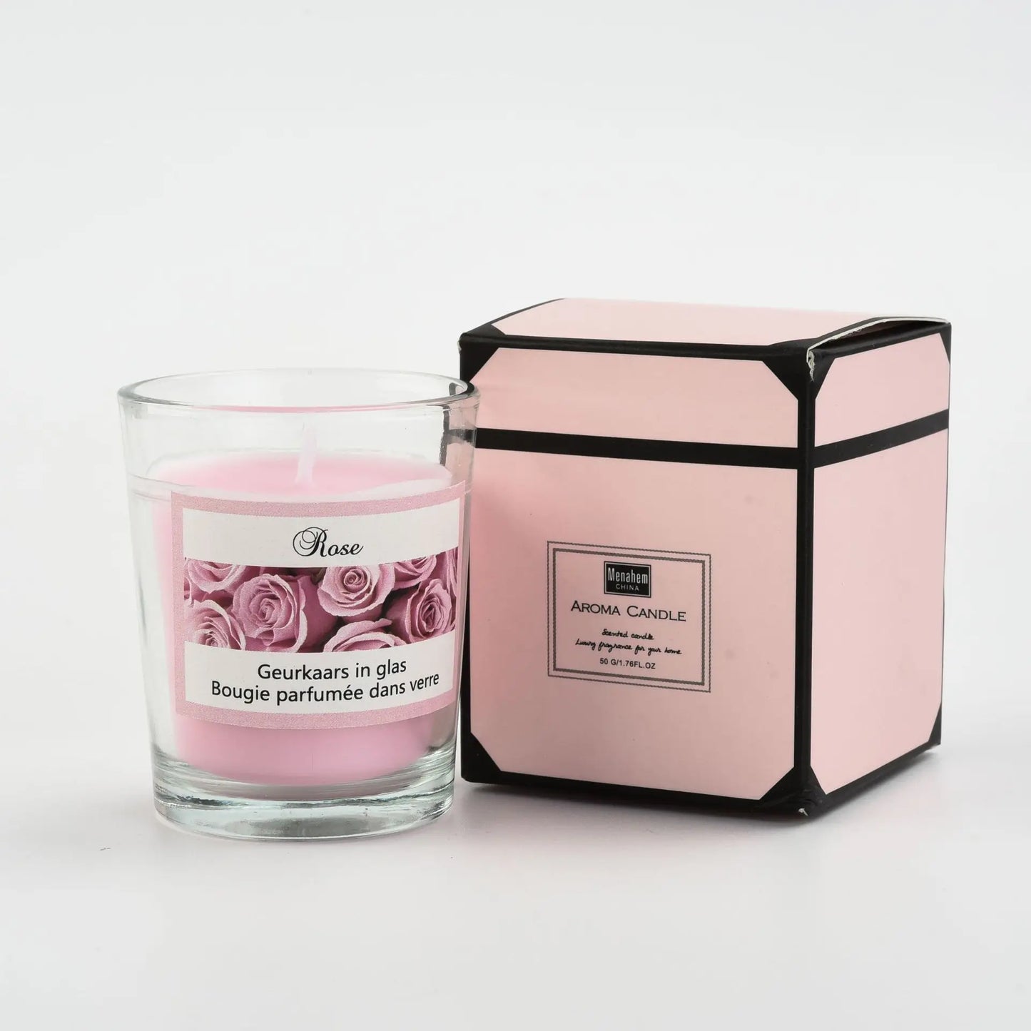 شمعة معطرة في كوب زجاجي.