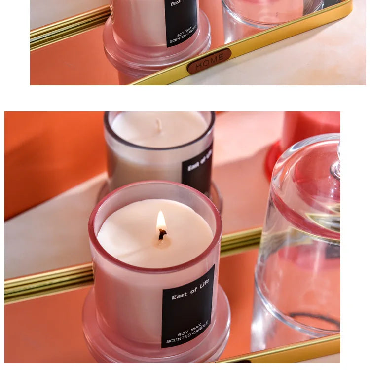 شمعة معطرة في كوب زجاجي.