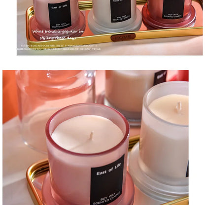 شمعة معطرة في كوب زجاجي.