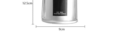 شمعة معطرة في كوب زجاجي.